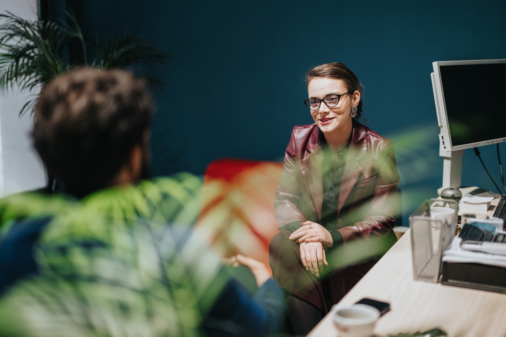 A,Businesswoman,Engages,In,A,Professional,Discussion,With,A,Client